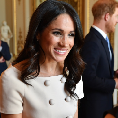 Meghan Markle in a tailored beige skirt suit