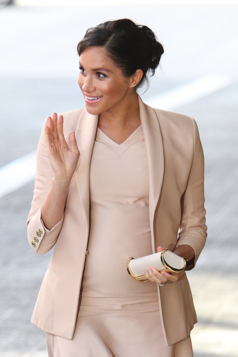 Meghan Markle in white belted brandon maxwell jacket, blue jeans